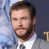 WATCH: A Shirtless Chris Hemsworth Gets Attacked by a Dog